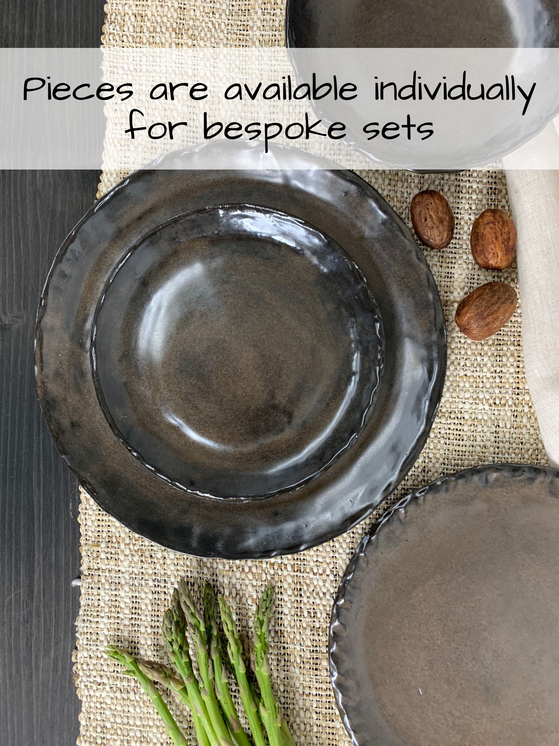 Handcrafted ceramic plates on a textured surface with text overlay