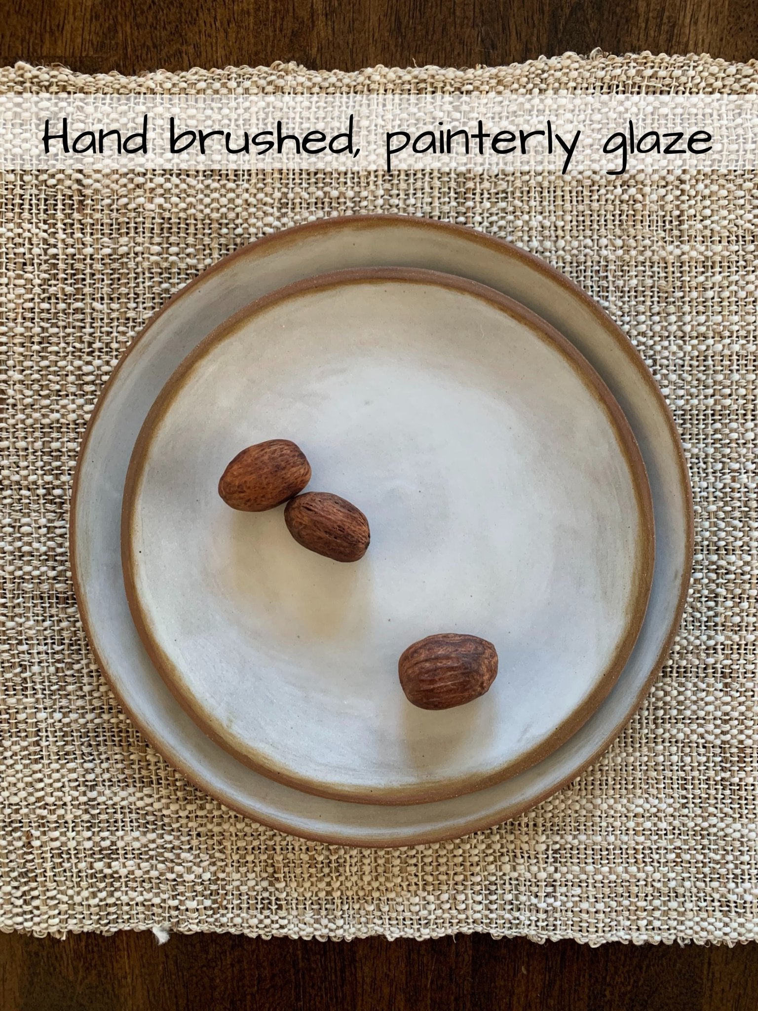 Handmade Ceramic plates with three nuts on a textured surface, text 'Hand brushed, painterly glaze' above.