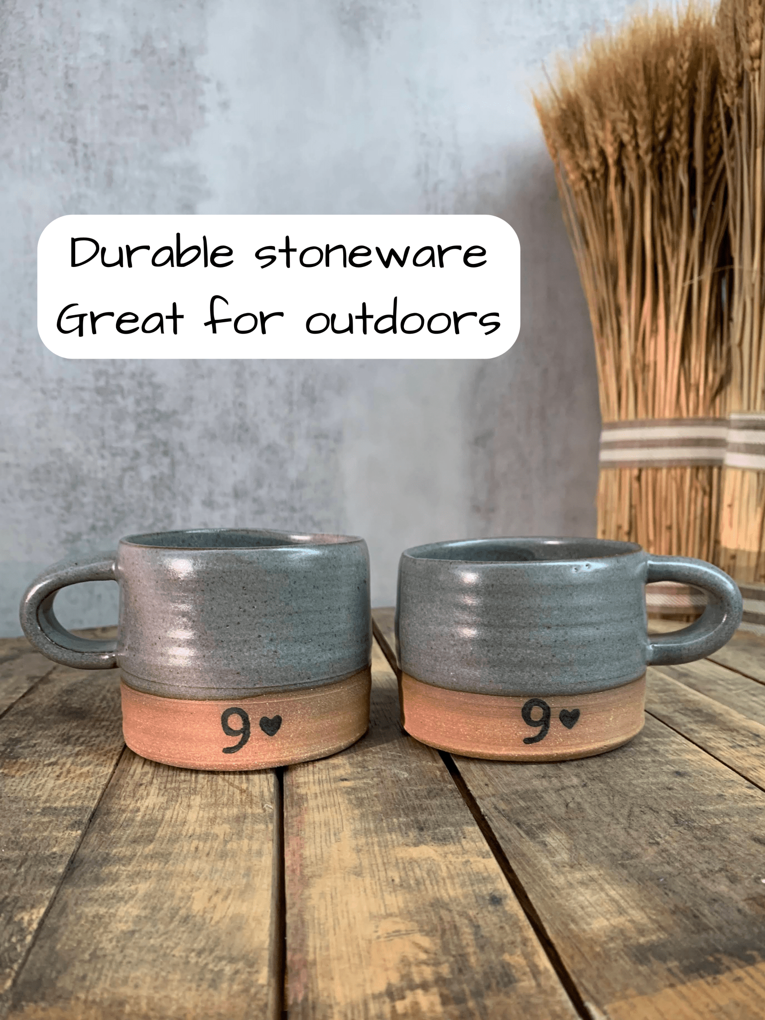 Two gray mugs with wooden bases on a wooden surface, text indicating durability and suitability for outdoors.